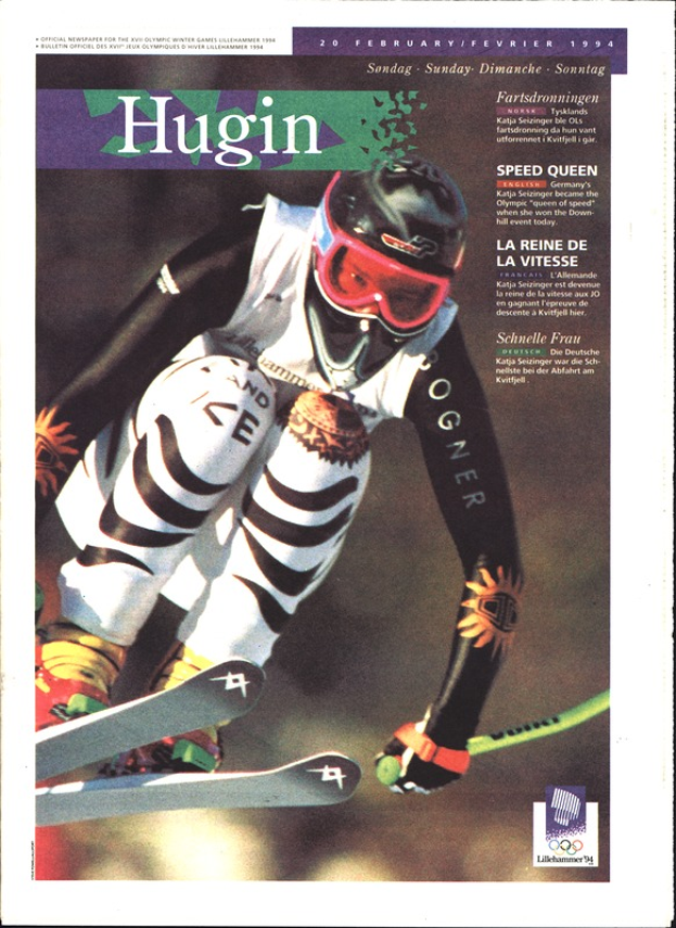 Ein Skispringer in der Luft mit Helm, Brille und Handschuhen, der Ski-Bretter hält, auf einem Magazin-Cover.