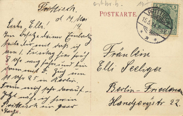 Alte deutsche Postkarte von Berlin nach Freiburg mit einer Briefmarke und handgeschriebenem Text.